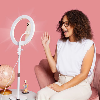 LITTIL Superstar Ring Light. Teacher sitting on a chair on a pink background.