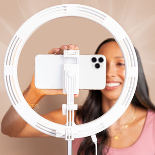 LITTIL Superstar Slim Ring Light. Woman holding phone in phone holder. 