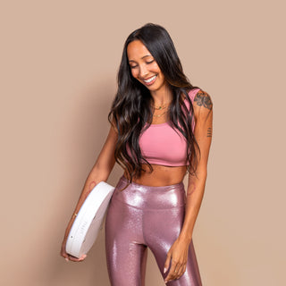 LITTIL Superstar Slim Ring Light. Woman smiling holding ring light on her hip.